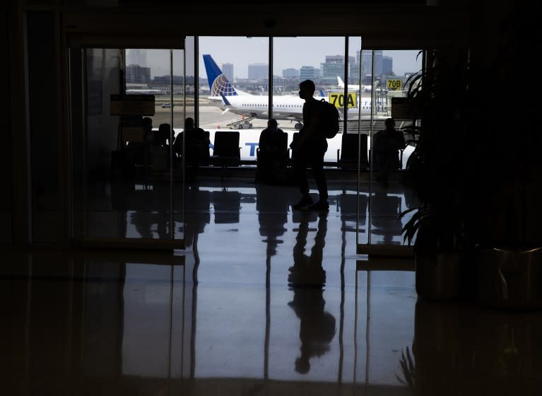 Los Angeles, CA - May 28: Amid a busy getaway travel day for the Memorial Day weekend and the first holiday since coronavirus pandemic restrictions have been relaxed, travelers make their way to their destinations at LAX, United Airlines, Terminal 7 in Los Angeles Friday, May 28, 2021. Officials say travelers should arrive early for Memorial Day weekend flights. After months of Los Angeles International Airport looking like a ghost town, holiday crowds are back. "We're seeing more travelers than we've seen in the last 14 months. We had over 75,000 people come through on Sunday alone to the TSA checkpoints, that's by far a record in 2021 for us," said LAX spokesperson Keith Montgomery. Photo taken in LAX on Friday, May 28, 2021 in Los Angeles, CA. (Allen J. Schaben / Los Angeles Times)