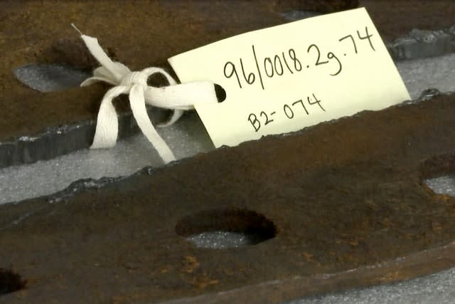 Metal parts recovered from the Titanic’s wreckage on shelves at a storage facility in Atlanta