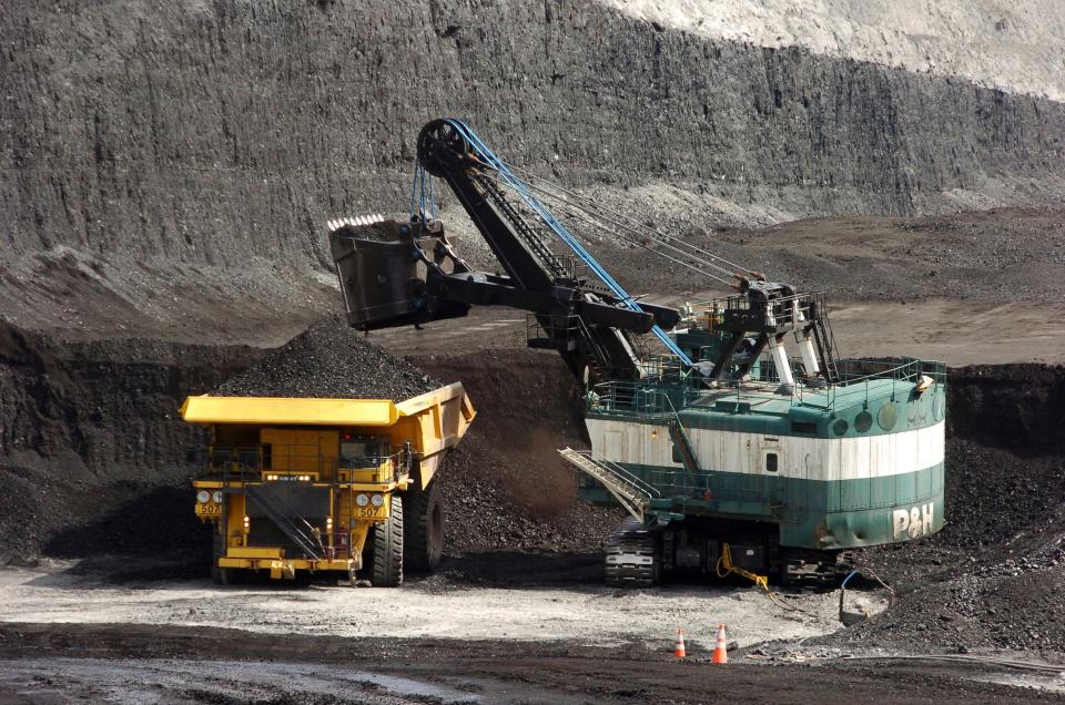 A shovel loads a haul truck that can carry up to 250 tons of coal at the Spring Creek coal mine near Decker in 2013.