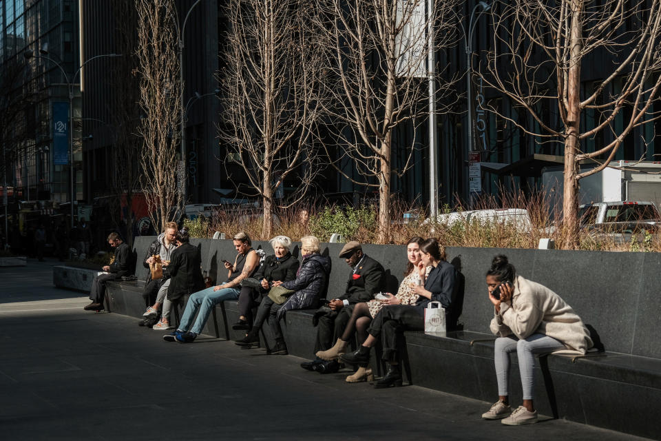 People relax in Manhattan on an unseasonably warm afternoon on Feb. 15, 2023 in New York. (Spencer Platt / Getty Images)