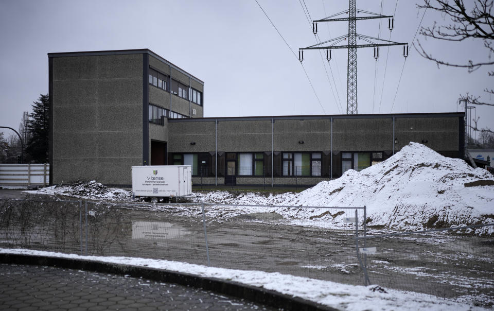 A Jehovah's Witness building is seen behind a fence in Hamburg, Germany Friday, March 10, 2023. Shots were fired inside the building used by Jehovah's Witnesses in the northern German city of Hamburg on Thursday evening, with multiple people killed and wounded, police said. (AP Photo/Markus Schreiber)