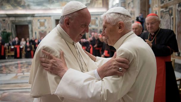 FILE PHOTO: Former pope Benedict, right, is greeted by Pope Francis during a ceremony to mark his 65th anniversary of ordination to the priesthood at the Vatican, on June 28, 2016. (Vatican Media/Reuters)