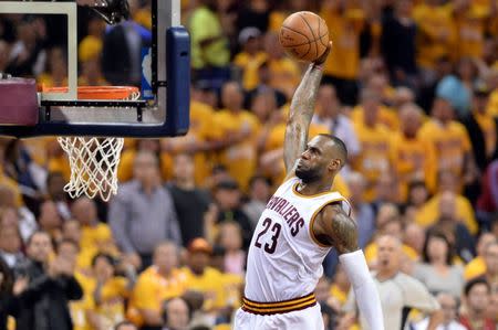 May 17, 2016; Cleveland, OH, USA; Cleveland Cavaliers forward LeBron James (23) slam dunks during the third quarter against the Toronto Raptors in game one of the Eastern conference finals of the NBA Playoffs at Quicken Loans Arena. The Cavs won 115-84. Mandatory Credit: Ken Blaze-USA TODAY Sports