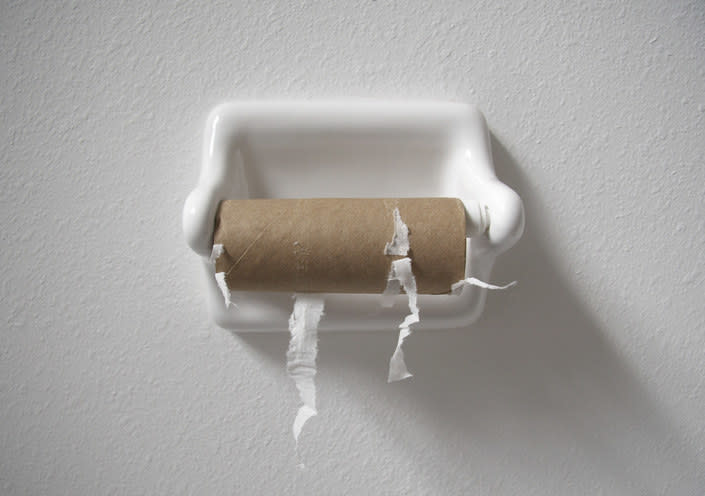 An empty roll of toilet paper