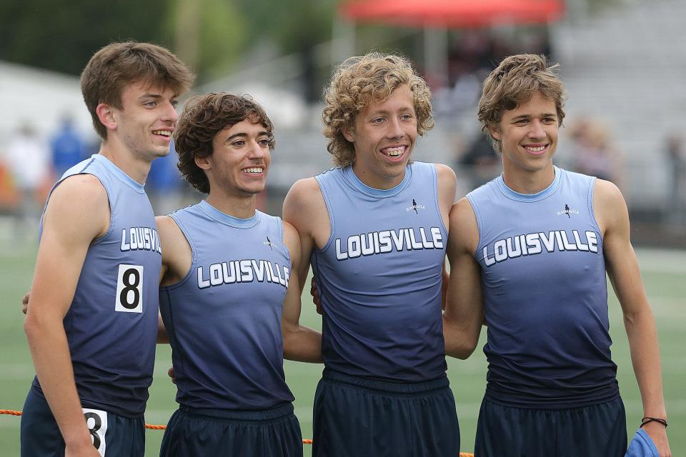 Louisville's boys 3,200-meter relay team of (from left) Bobby Ganser, Colby Adams, Stephen Ulrich and Owen Pukys, pose for a photo after winning a Division I district title Wednesday at Hoover.