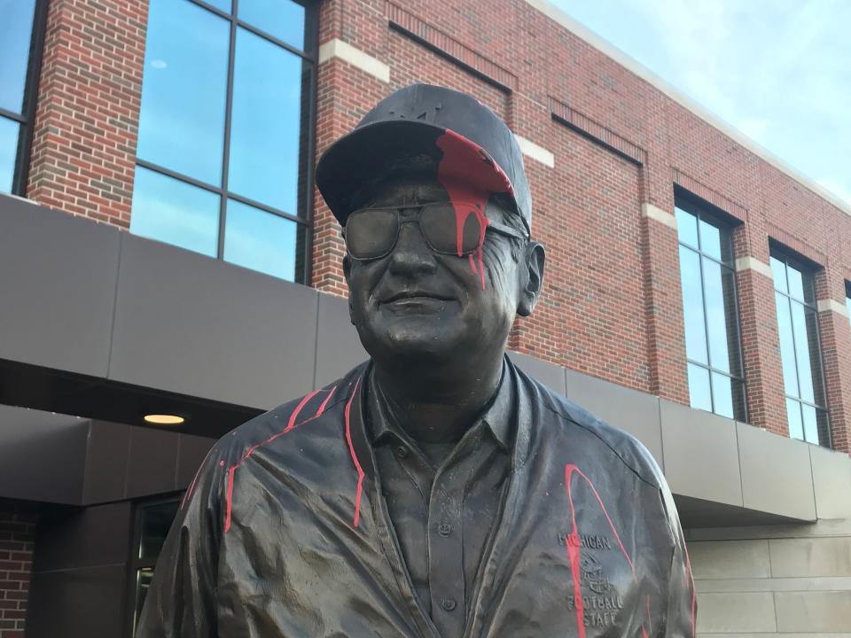 The Bo Schembechler statue was sprayed with red paint in front of the football building on the University of Michigan campus in Ann Arbor Wednesday, Nov. 24, 2021.