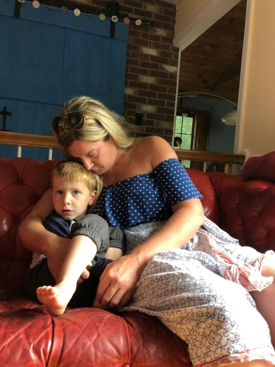 Laura Hill holds her 4-year old son Luciano at home in Raynham. Laura died Dec. 5, 2023, in Raynham while giving birth to her third child, Lianna.