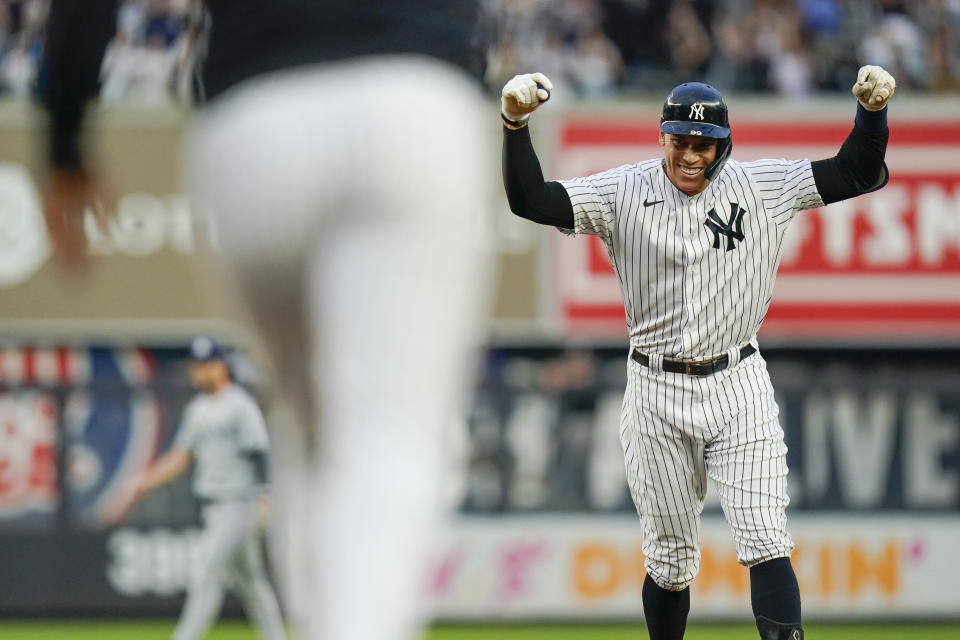 New York Yankees' Aaron Judge celebrates with teammates after hitting a winning RBI-single during the ninth inning of a baseball game against the Tampa Bay Rays, Sunday, Oct. 3, 2021, in New York. (AP Photo/Frank Franklin II)