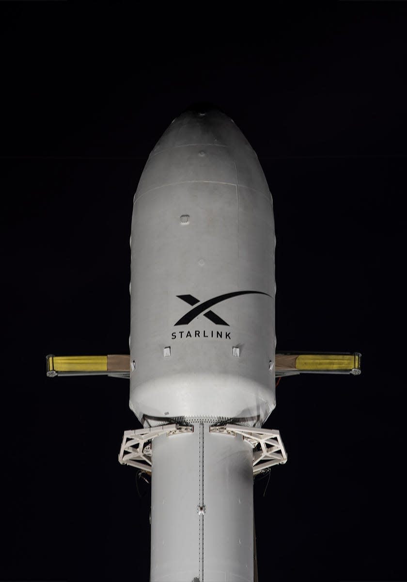 A SpaceX Falcon 9 fairing branded with the comapny's Starlink internet service logo.