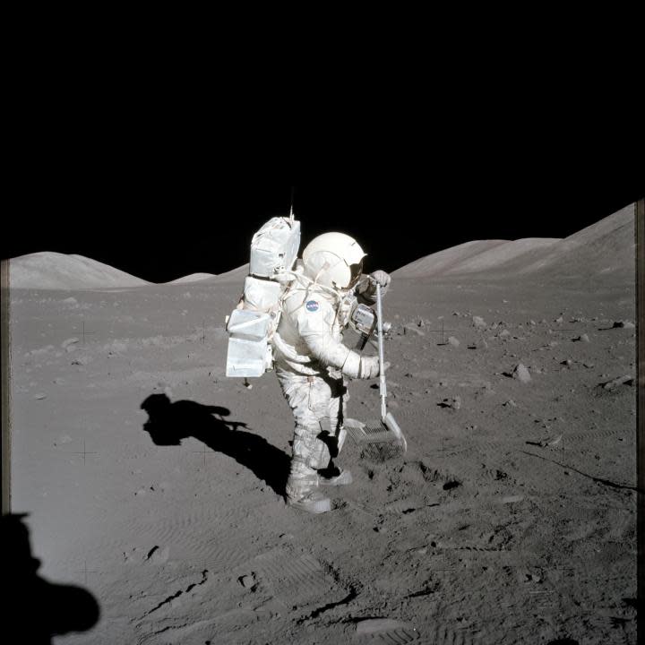 (11 Dec. 1972) — Scientist-astronaut Harrison H. Schmitt, lunar module pilot, collects lunar rake samples at Station 1 during the first Apollo 17 extravehicular activity (EVA) at the Taurus-Littrow landing site. (NASA)