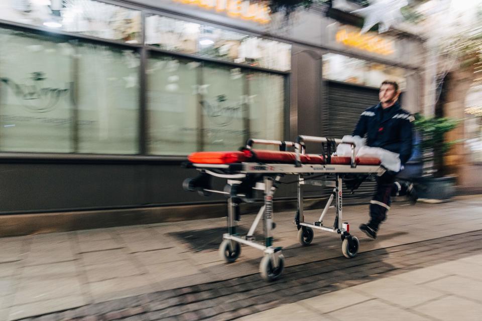 An emergency worker runs with a stretcher towards the scene of a shooting near the Christmas market in Strasbourg, eastern France, on Dec. 11, 2018. (Photo: Abdesslam Mirdass/AFP/Getty Images)