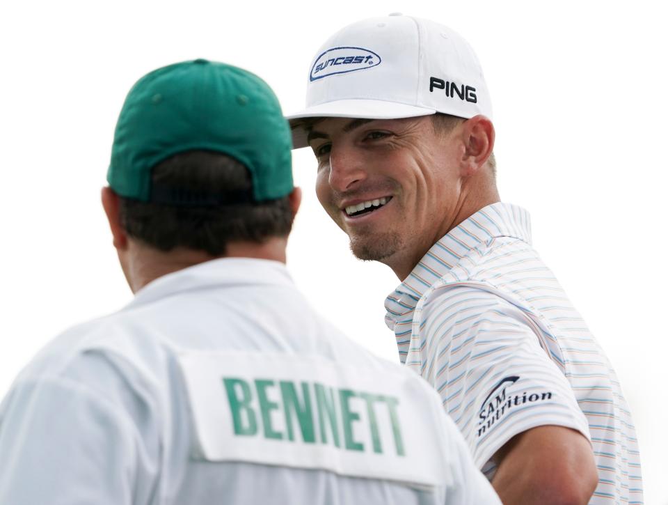 Apr 7, 2023; Augusta, Georgia, USA; Sam Bennett talks with his caddie Brian Kortan talk on the no. 18 green during the second round of The Masters golf tournament. Mandatory Credit: Katie Goodale USA TODAY Network