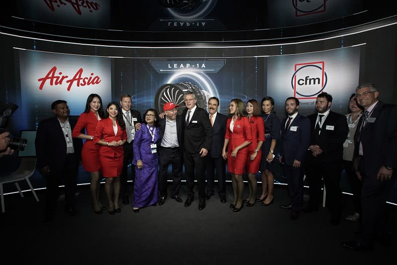 Representatives of CFM and AirAsia pose for a photo.