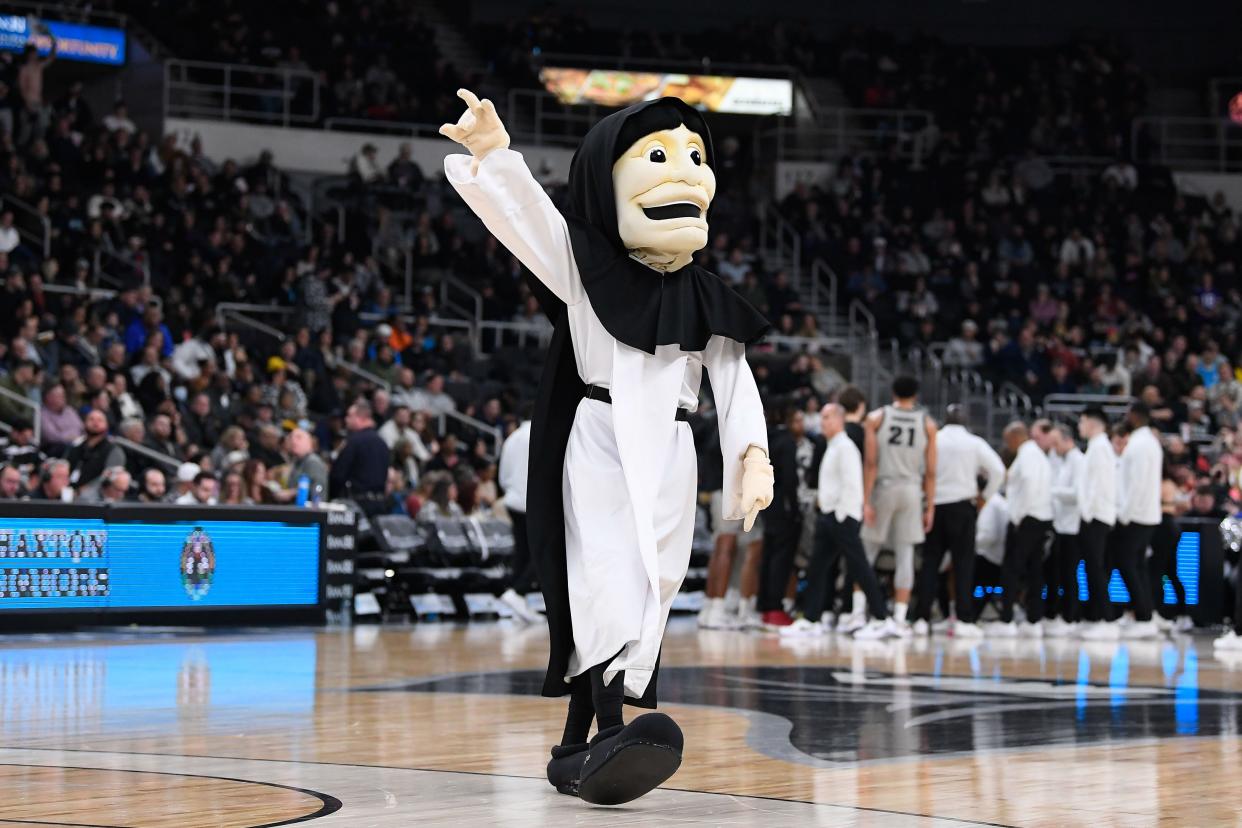 "Friar Dom" waves to fans during  a Jan. 25 game against the Butler Bulldogs at Amica Mutual Pavilion.