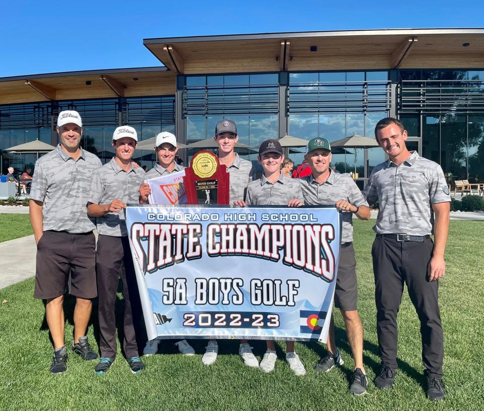 Fossil Ridge boys golfers and coaches celebrate their Colorado 5A team state championship at City Park Golf Course in Denver on Tuesday, Oct. 4, 2022.