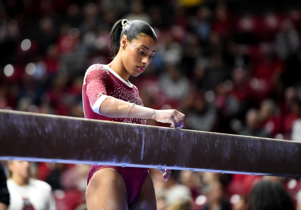 Mar 8, 2024; Tuscaloosa, Alabama, USA; Alabama gymnast Shania Adams chalks a mark on the beam as she gets ready during a quad meet with Illinois, Minnesota, and Talladega at Coleman Coliseum.