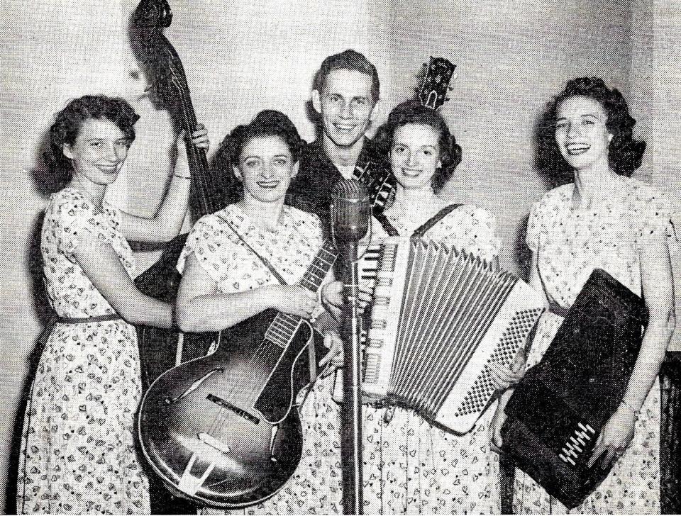 Chet Atkins and the Carter Family photographed for KWTO in November 1945.
