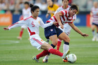 Wang Dongni #5 of China and Abby Wambach #20 battle for the ball at PPL Park on May 27, 2012 in Chester, Penn. (Photo by Drew Hallowell/Getty Images)