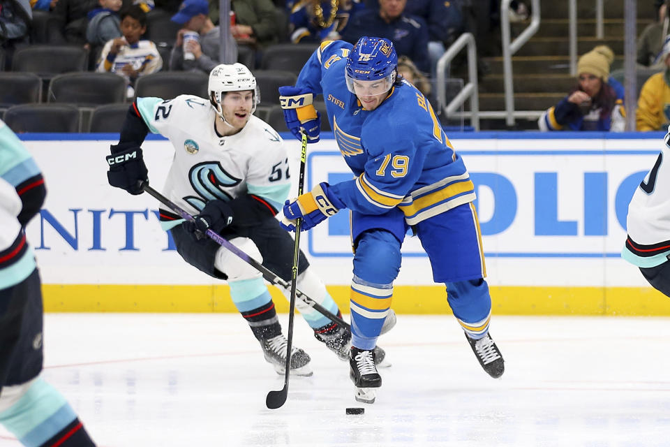 St. Louis Blues' Sammy Blais (79) skates with the puck as Seattle Kraken's Tye Kartye (52) defends during the second period of an NHL hockey game Saturday, Oct. 14, 2023, in St. Louis. (AP Photo/Scott Kane)