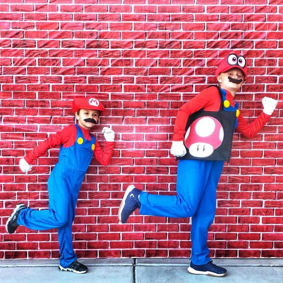 <p>Your boys love playing video games, so it only makes sense to dress them up as the main characters from the Mario franchise. These outfits are super easy to DIY (although you can also find dozens of <a href="https://www.amazon.com/Cloth-Kiss-Costume-Brothers-Halloween/dp/B07GV11B9T/?tag=syn-yahoo-20&ascsubtag=%5Bartid%7C10055.g.33417241%5Bsrc%7Cyahoo-us" rel="nofollow noopener" target="_blank" data-ylk="slk:pre-made versions;elm:context_link;itc:0;sec:content-canvas" class="link ">pre-made versions</a> online). </p><p><a class="link " href="https://www.amazon.com/Brothers-Costume-Halloween-Children-19-68-20-47Inch/dp/B07YJCSB7P/?tag=syn-yahoo-20&ascsubtag=%5Bartid%7C10055.g.33417241%5Bsrc%7Cyahoo-us" rel="nofollow noopener" target="_blank" data-ylk="slk:SHOP MARIO HATS;elm:context_link;itc:0;sec:content-canvas">SHOP MARIO HATS</a></p><p><a href="https://www.instagram.com/p/BpqZGNYB8pb/" rel="nofollow noopener" target="_blank" data-ylk="slk:See more on Instagram »;elm:context_link;itc:0;sec:content-canvas" class="link "><em>See more on Instagram »</em></a><br></p>