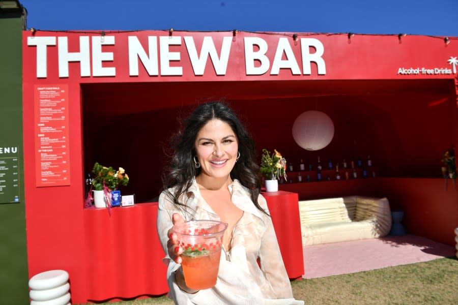 Brianda Gonzalez, founder and CEO of The New Bar, poses infront of The New Bar during 2024 Coachella Valley Music and Arts Festival at Empire Polo Club on April 14, 2024 in Indio, California. Deborah Biegaj has been coming to Coachella for about a decade, and heavy drinking was a part of the package at the mammoth festival in the California desert — it’s just what you did. But these days, she and her partner Piotr are imbibing less booze: “I felt like drinking more took away from the festival experience,” she says. (Photo by VALERIE MACON / AFP) (Photo by VALERIE MACON/AFP via Getty Images)