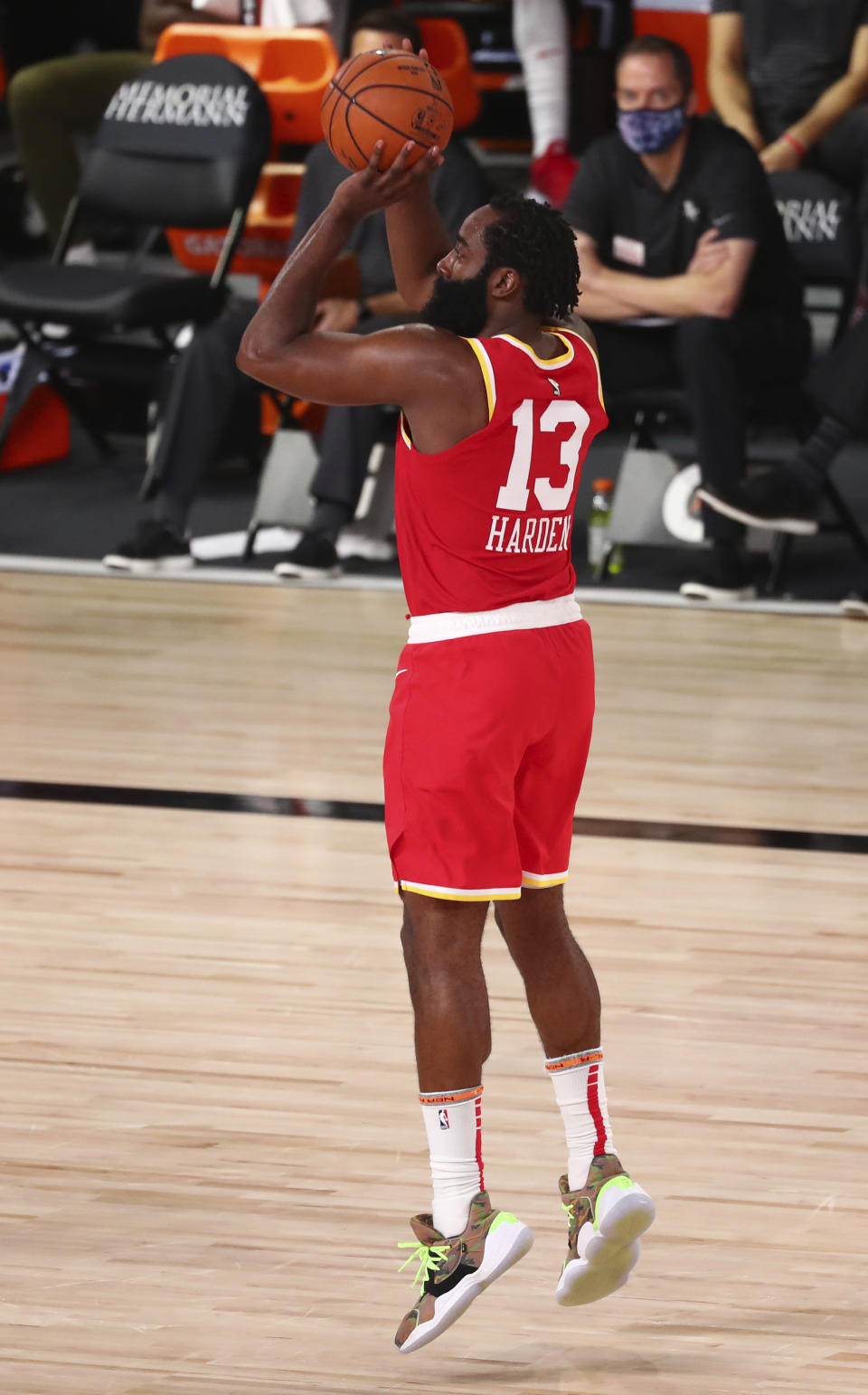 Houston Rockets guard James Harden (13) shoots a three-point basket against the Indiana Pacers in the second half of an NBA basketball game Wednesday, Aug. 12, 2020, in Lake Buena Vista, Fla. (Kim Klement/Pool Photo via AP)