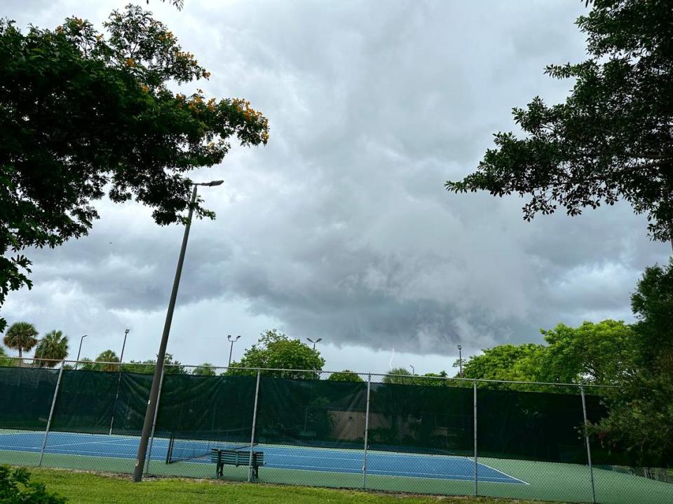 Lightning flashes from storm clouds moving in over a Kendall neighborhood around 2:30 p.m. Thursday, July 27, 2023. A tropical system in the Atlantic is sending moisture to Florida, according to National Weather Service in Miami.