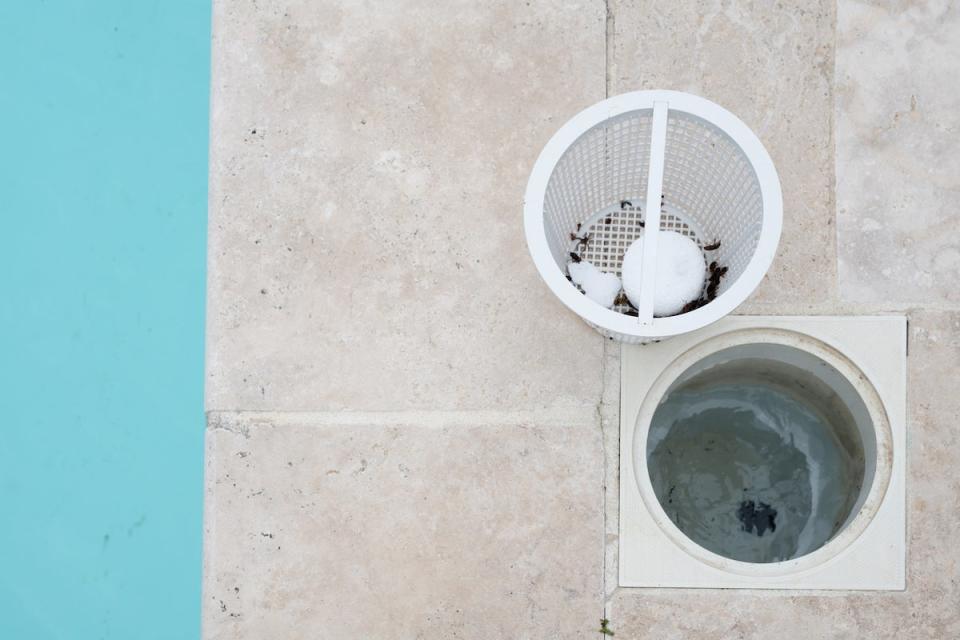 inground pool skimmer with basket of debris