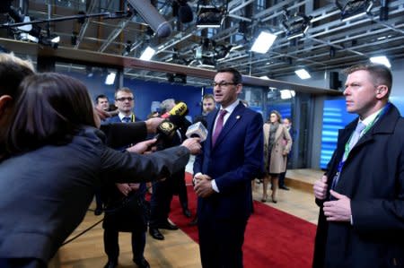 Poland's Prime Minister Mateusz Morawiecki talks to media before the Visegrad Group meeting in Brussels, Belgium, December 14, 2017. REUTERS/Eric Vidal