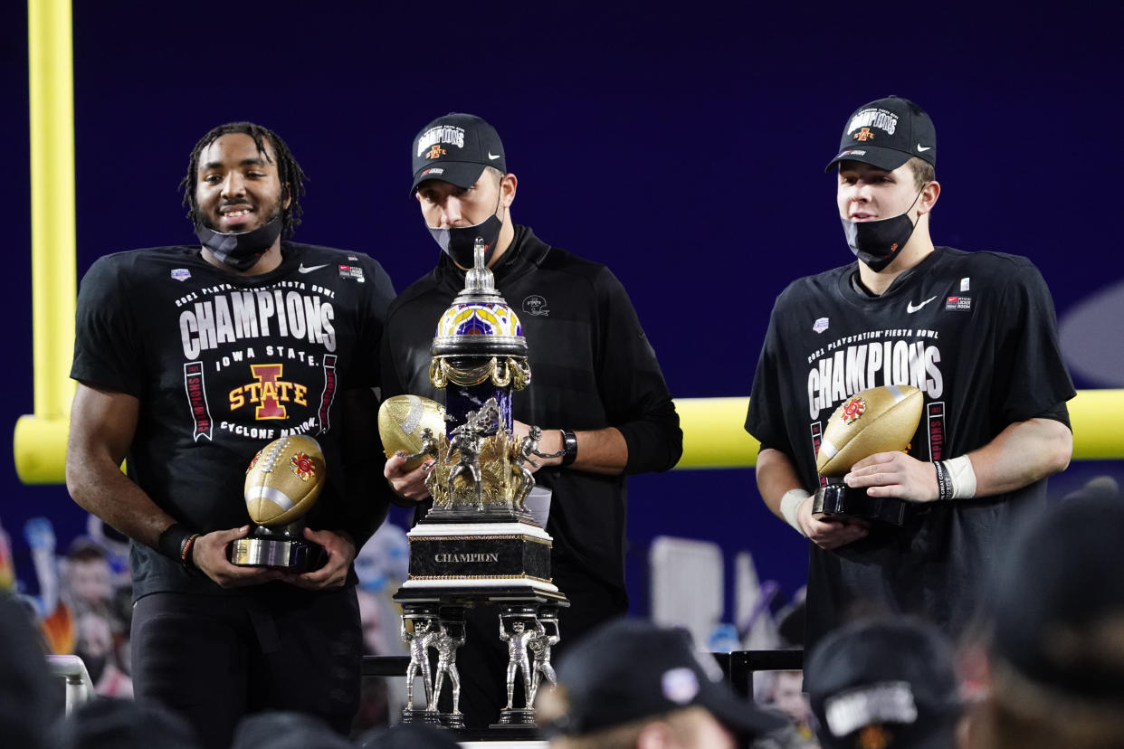 From left; Iowa State linebacker and defensive player of the game O'Rien Vance, head coach Matt Campbell and offense player of the game, quarterback Brock Purdy celebrate after the Fiesta Bowl NCAA college football game against Oregon, Saturday, Jan. 2, 2021, in Glendale, Ariz. Iowa State won 34-17. (AP Photo/Rick Scuteri)