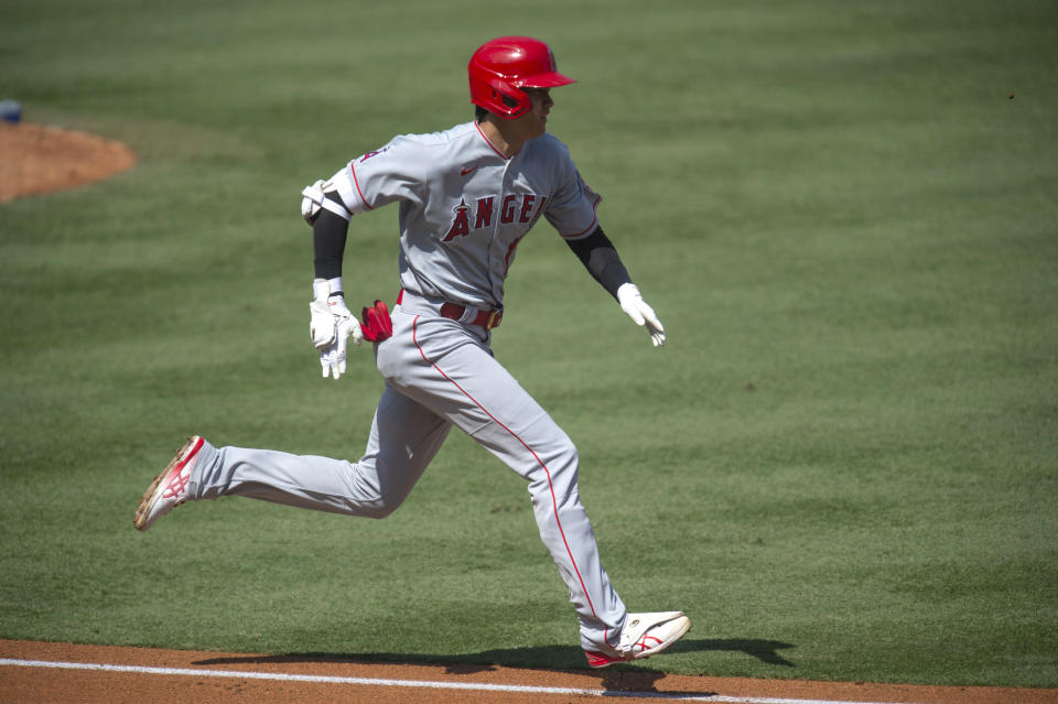 Los Angeles Angels' Shohei Ohtani sprints to first base for his infield single during the first inning of a baseball game against the Los Angeles Dodgers in Los Angeles, Sunday, Sept. 27, 2020. (AP Photo/Kyusung Gong)