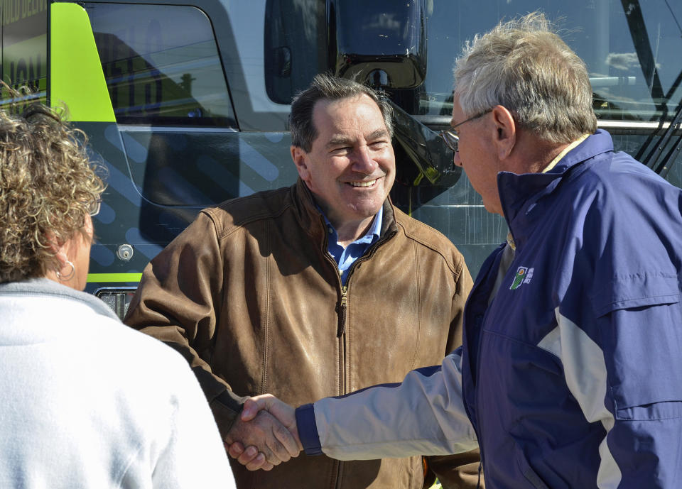 Donnelly, center, talks with a farm couple during a campaign stop in Terre Haute, Ind. (Photo: Austen Leake/Tribune-Star via AP)