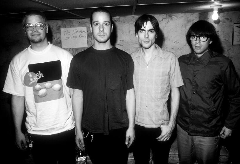 Patrick Wilson, Matt Sharp, Brian Bell, Rivers Cuomo pose for a portrait in Minneapolis in 1994.