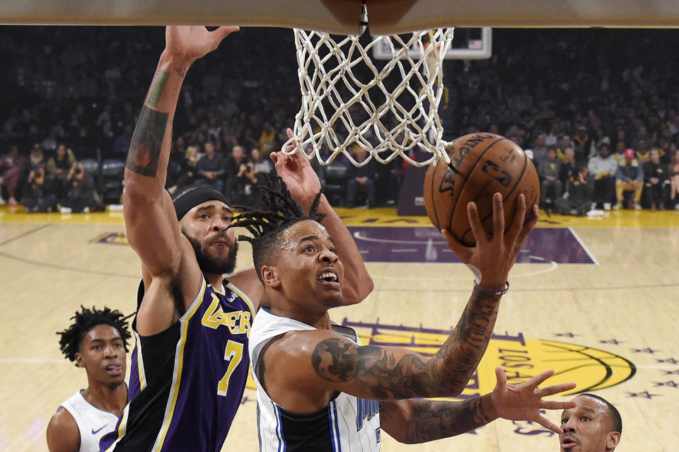 Orlando Magic guard Markelle Fultz, right, shoots as Los Angeles Lakers center JaVale McGee defends during the first half of an NBA basketball game Wednesday, Jan. 15, 2020, in Los Angeles. (AP Photo/Mark J. Terrill)