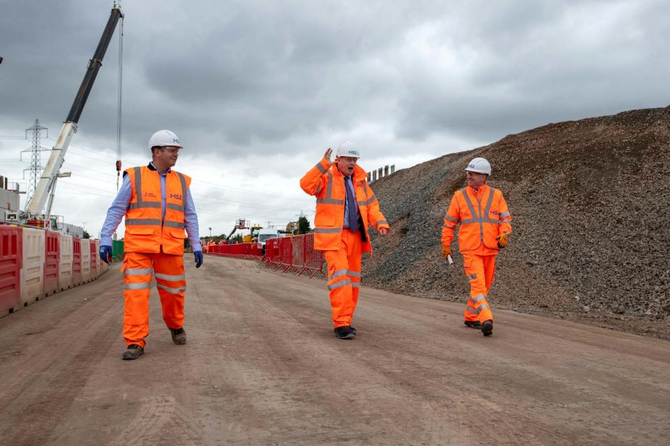 The Prime Minister (centre) marked the official start of the project in Solihull (AP)