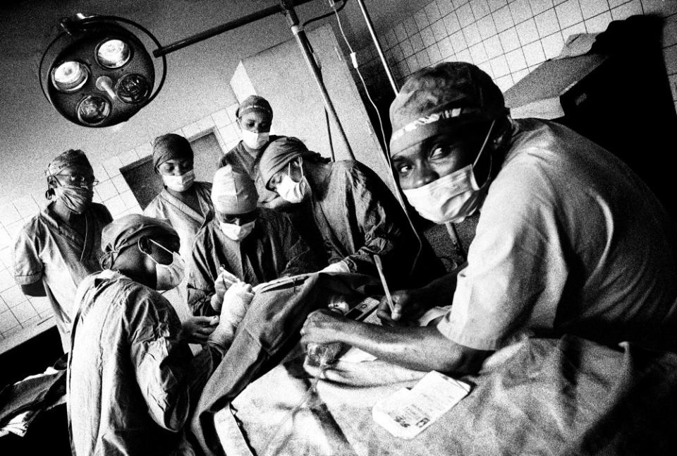 Dr. Desiré Alumeti Munyali (center), pediatric surgeon, performing a procedure on an infant with a team of other doctors and nurses at Panzi Hospital in Bukavu, Democratic Republic of the Congo.<span class="copyright">Platon</span>