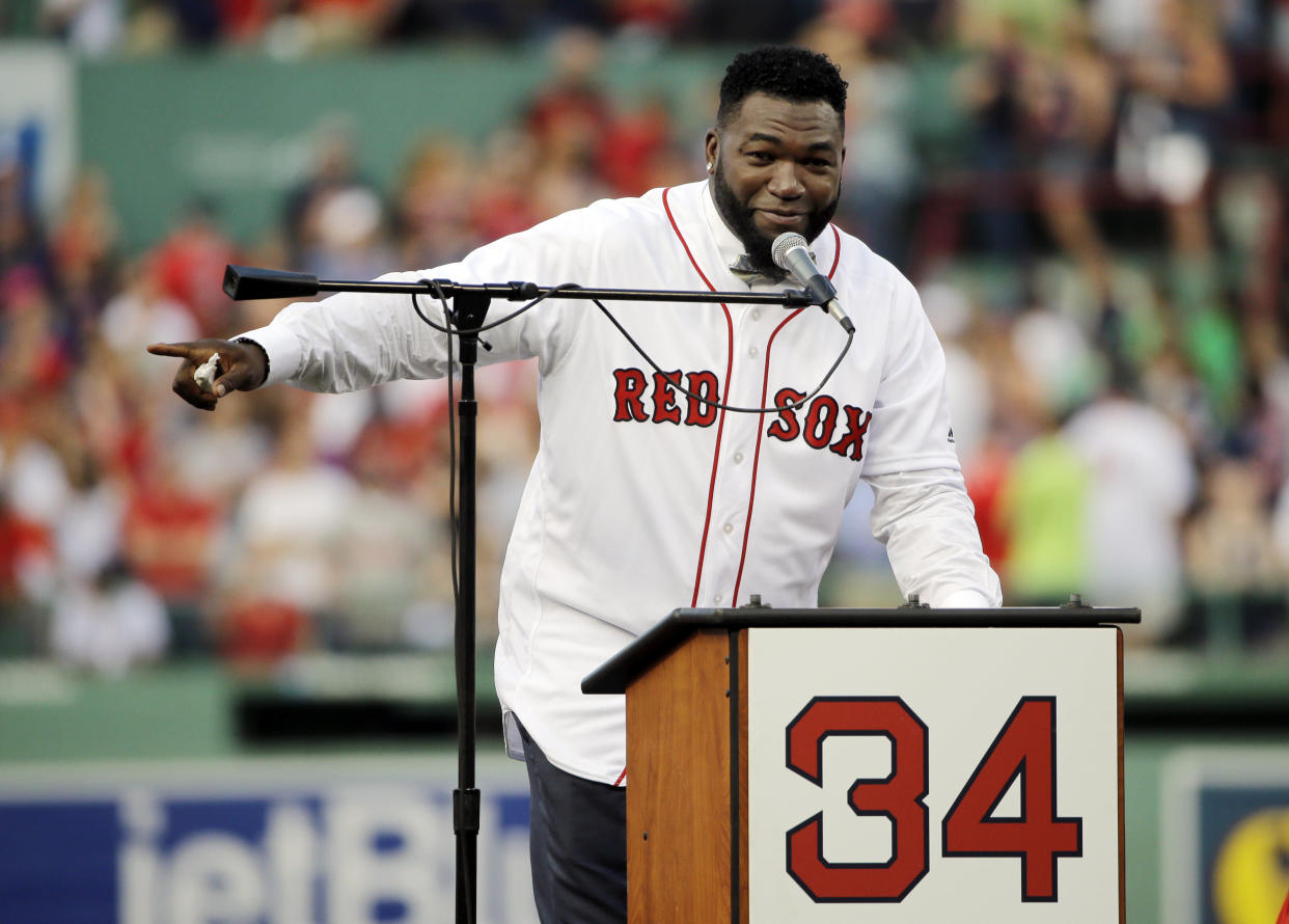 Boston Red Sox baseball great David Ortiz speaks to fans Friday, June 23, 2017, at Fenway Park in Boston as the team retired his No. 34 worn when he led the franchise to three World Series titles. It will be the 11th number retired by the Red Sox. (AP Photo/Elise Amendola)