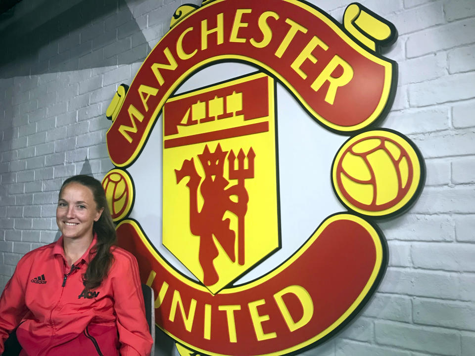 Man United women's team manager Casey Stoney smiles during an interview with the Associated Press at Manchester United's AON Training Complex in Manchester, England, Thursday, Aug. 16, 2018. Stoney has rebuilt the Man United women's soccer squad and the rebooted women’s side plays its first game upcoming Sunday Aug. 19, 2018, against Liverpool, with Stoney as coach. (AP Photo/Rob Harris)