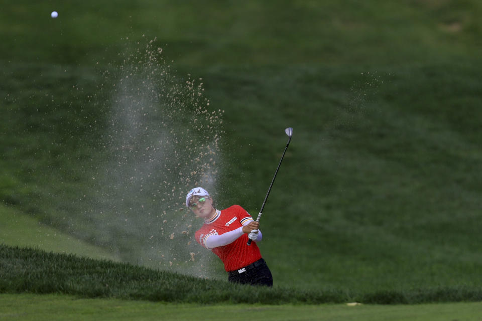 Minjee Lee, of Australia, plays a shot out of a bunker on the fourth fairway during the second round of the LPGA Tour Kroger Queen City Championship golf tournament in Cincinnati, Friday, Sept. 9, 2022. (AP Photo/Aaron Doster)