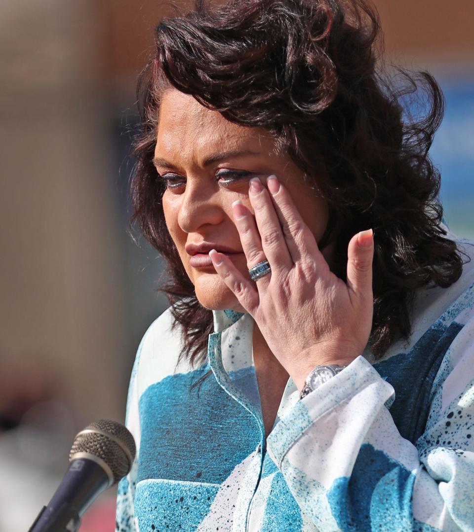 Angela Grabovsky, an Indianapolis resident from Ukraine, wipes a tear as she speaks during a rally in support for Ukraine Saturday, March 5, 2022 on Monument Circle in Indianapolis.