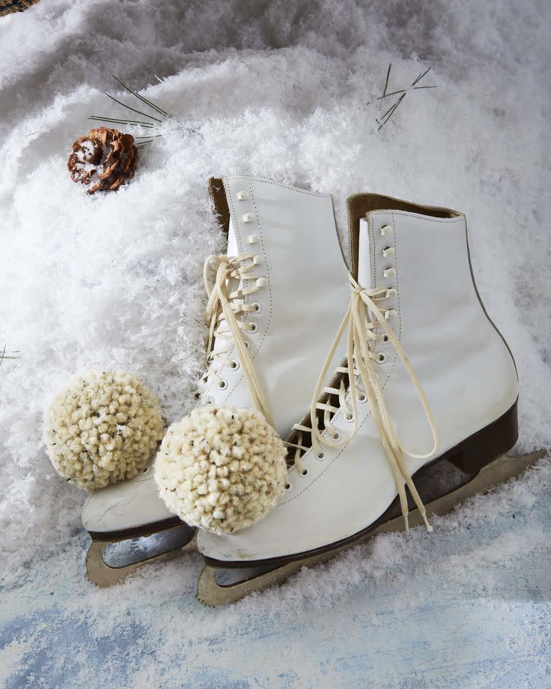 ice skates with pom poms