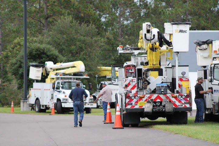 Tree and lineman crews arrive at Gainesville Regional Utilities' Eastside Operations Center on Tuesday night ahead of the arrival of Hurricane Ian.