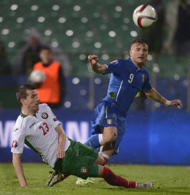 Italy's Forward Ciro Immobile shoots in front of Bulgaria's Aleksandar Aleksandrov during the EURO 2016 Group H football match in Sofia on March 28, 2015