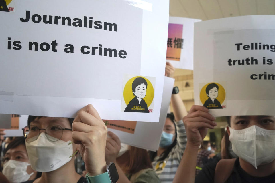 FILE - Press freedom advocates rally outside a court in Hong Kong, Thursday, April 22, 2021. China has criticized a press freedom survey, Friday, Nov. 5, 2021, from the Hong Kong Foreign Correspondents' Club that found nearly half its members were considering leaving the city. The survey said the members are concerned about a decline in press freedoms under a sweeping new national security law imposed by Beijing following massive anti-government protests in 2019. (AP Photo/Kin Cheung)