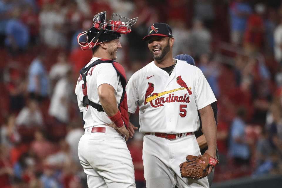St. Louis Cardinals catcher Andrew Knizner (7) and teammate Albert Pujols celebrate their team's 15-6 victory over the San Francisco Giants after a baseball game on Sunday, May 15, 2022, in St. Louis. (AP Photo/Joe Puetz)