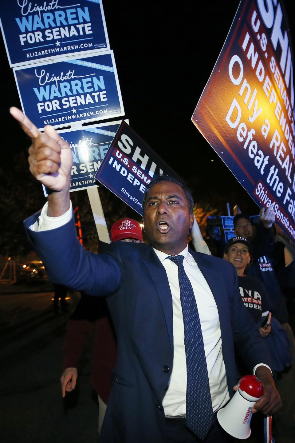 Independent candidate for U.S. Senate from Massachusetts Shiva Ayyadurai protests being excluded from a debate between Sen. Elizabeth Warren and her Republican opponent Geoff Diehl in Boston, Friday, Oct. 19, 2018. (AP Photo/Michael Dwyer)