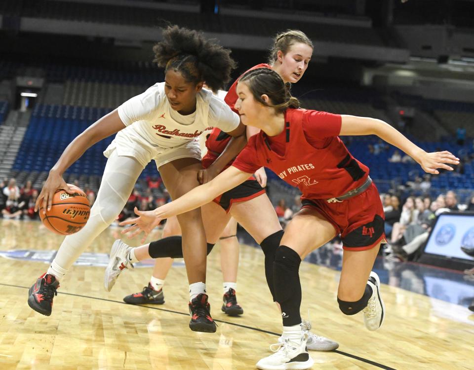 Liberty's Jacy Abii, left, grabs the ball from Lubbock-Cooper's Majik Esquivel during the UIL Class 5A girls state championship basketball game, Saturday, March 4, 2023, at the Alamodome in San Antonio.