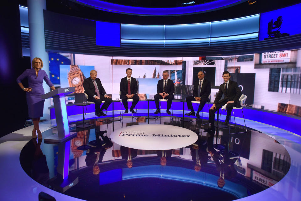 Host Emily Maitlis, Boris Johnson, Jeremy Hunt, Michael Gove, Sajid Javid and Rory Stewart during the BBC TV debate at BBC Broadcasting House in London featuring the contestants for the leadership of the Conservative Party. PRESS ASSOCIATION Photo. Picture date: Tuesday June 18, 2019. See PA story POLITICS Tories. Photo credit should read: Jeff Overs/BBC/PA Wire NOTE TO EDITORS: Not for use more than 21 days after issue. You may use this picture without charge only for the purpose of publicising or reporting on current BBC programming, personnel or other BBC output or activity within 21 days of issue. Any use after that time MUST be cleared through BBC Picture Publicity. Please credit the image to the BBC and any named photographer or independent programme maker, as described in the caption.