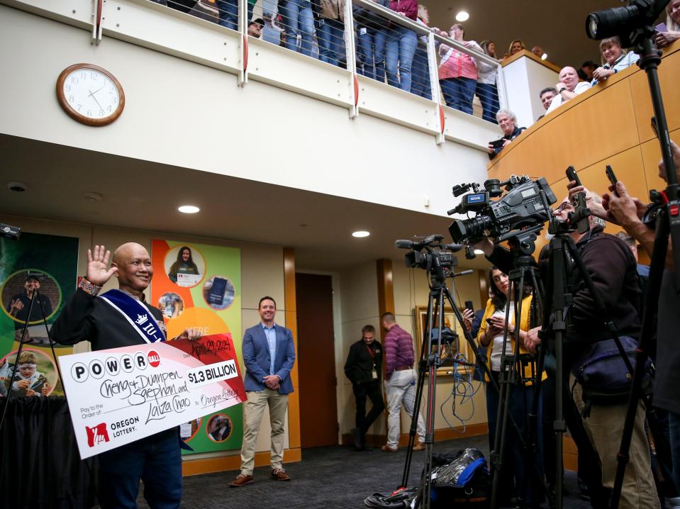 Cheng "Charlie" Saephan is announced as one of the three winners of last month's $1.3 billion Powerball on Monday, April 29, 2024 at the Oregon Lottery headquarters in Salem, Ore. His wife, Duanpen Saephan, and friend, Laiza Chao, were also winners.