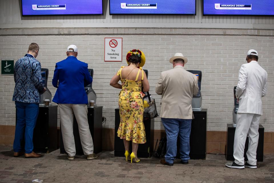 People placed their bets in the grandstand of Churchill Downs on Kentucky Derby day. May 7, 2022